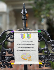 Individually crafted Mardi Gras scroll consisting of sketches and poems hung in celebration.